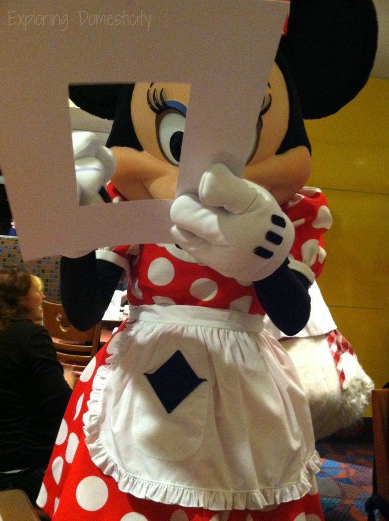 Minnie at Chef Mickeys. Tip: have characters sign a photo map so you can have the signatures around your vacation photo