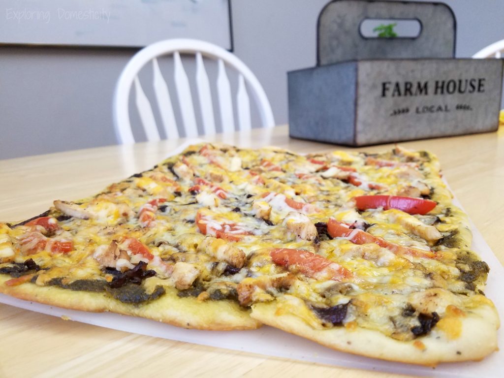 Balsamic Onion Pesto Pizza - rich pesto sauce, sweet onions, chicken, tomatoes, and Crystal Farms Cheese - SO GOOD!