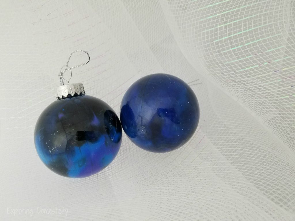 DIY Galaxy Ornaments with acrylic paint pour