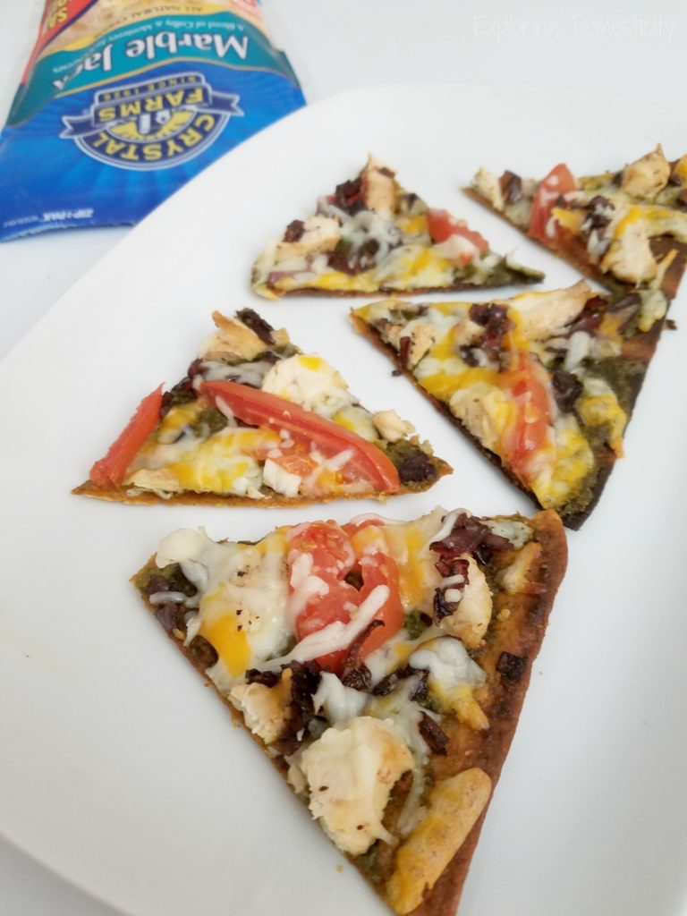 Flat Bread Pizza with Balsamic Caramelized Onions, Pesto sauce, and Crystal Farms Cheese