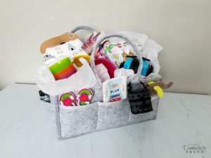 Baby Shower Gift Ideas - Our favorite baby items showcased in a diaper caddy
