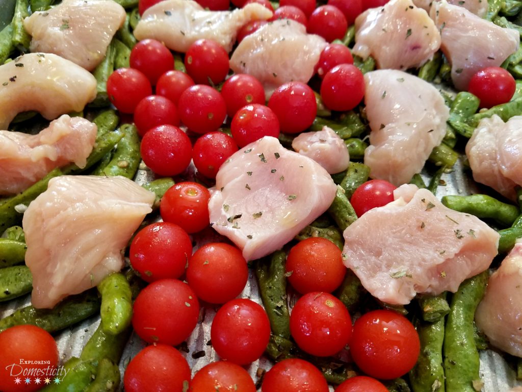 Easy sheet pan meal with chicken, green beans, and tomatoes