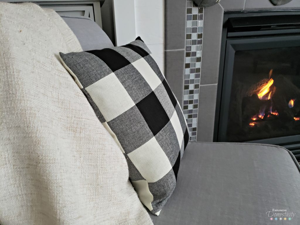 Setting the Holiday Mood - a fireplace and cozy holiday fabrics