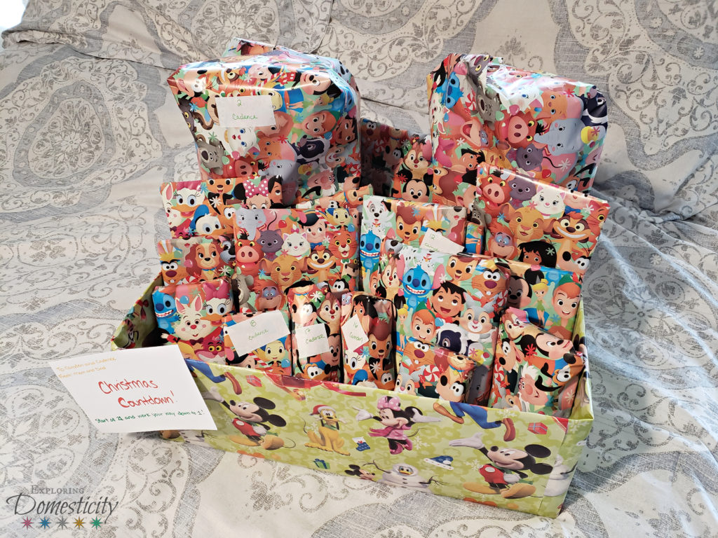 Surprise Disney Vacation - Disney gifts wrapped in Disney wrapping paper. Countdown to the big surprise!