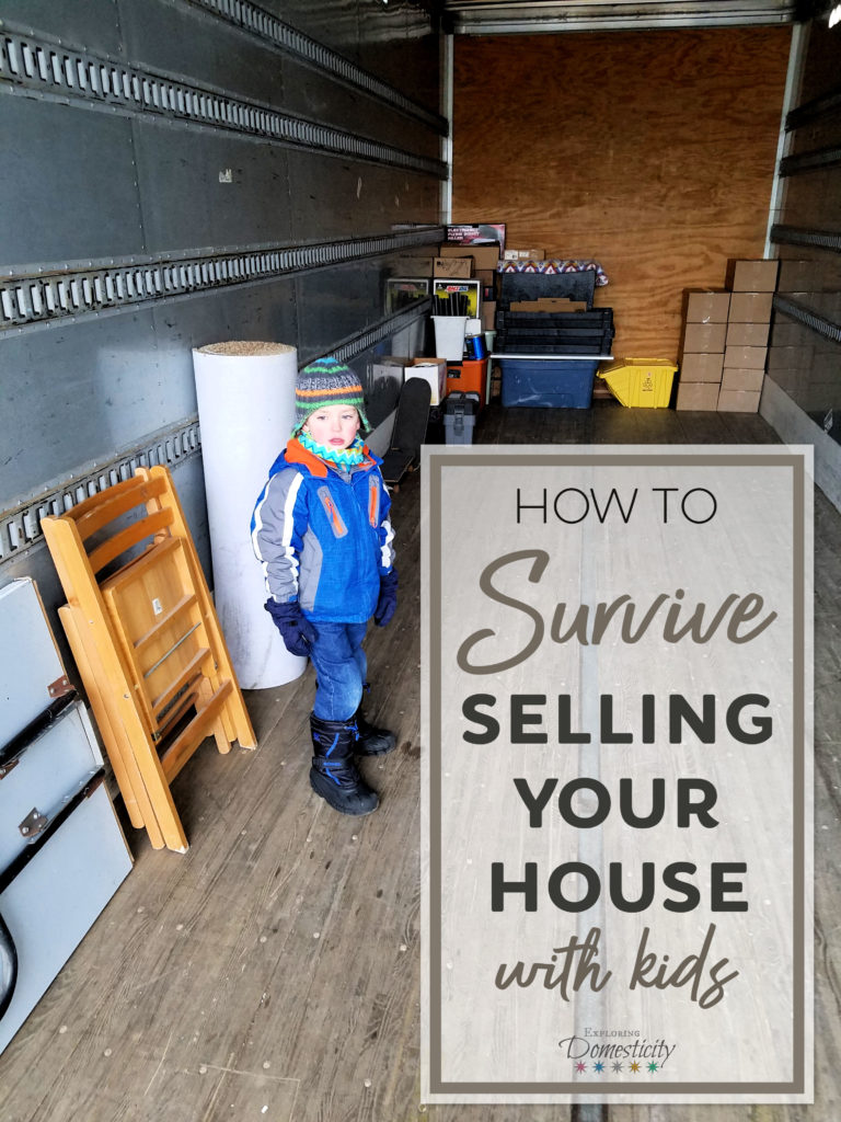How to Survive Selling your house with kids - kiddo in moving van