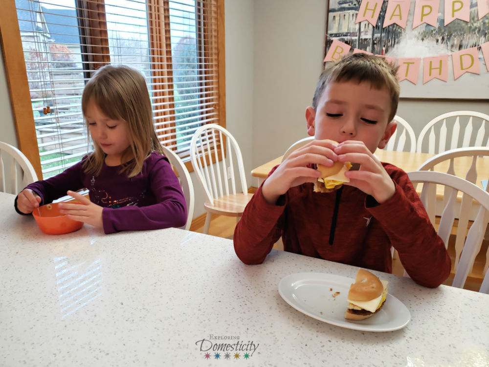 kids eating breakfast - cereal and breakfast sandwich -our morning-routine