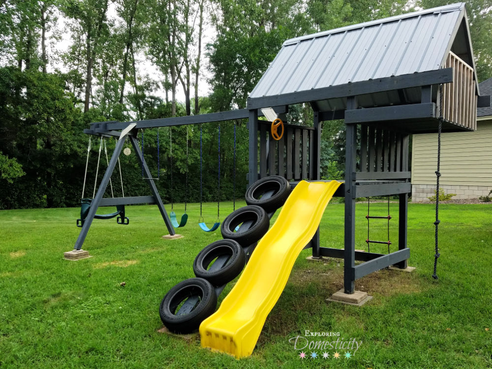 Old swing set with new paint, slide, tire ladder, etc.