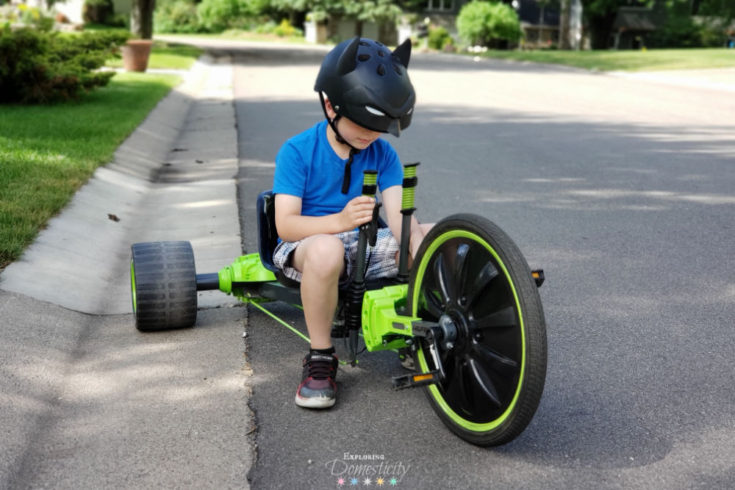 Boy riding Huffy Green Machine in Batman Bike Helmet