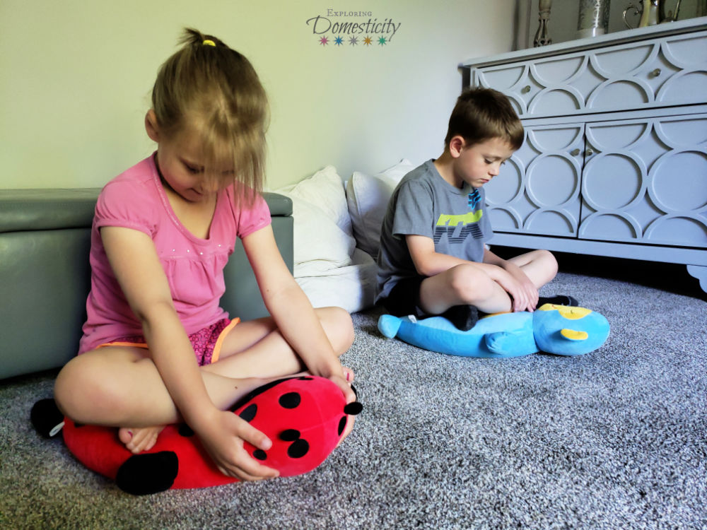 two kids practicing meditation and mindfulness with Zafooz Lotus Ladybug and Mindful Monkey