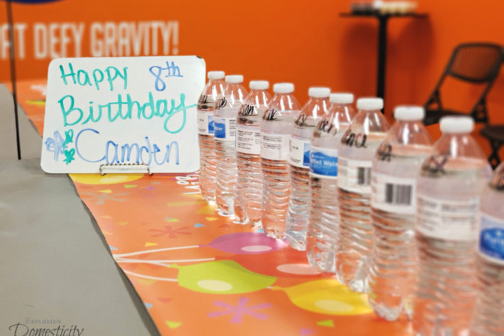 Urban Air Adventure Park Birthday party room with water bottles and birthday sign