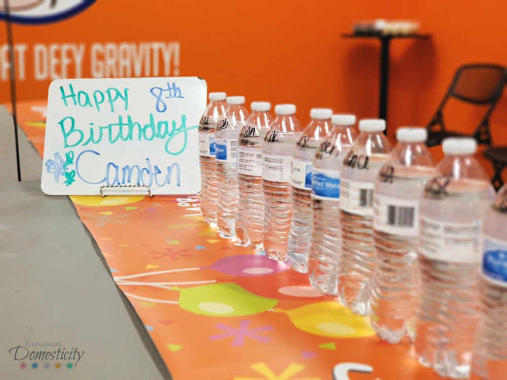 Urban Air Adventure Park Birthday party room with water bottles and birthday sign