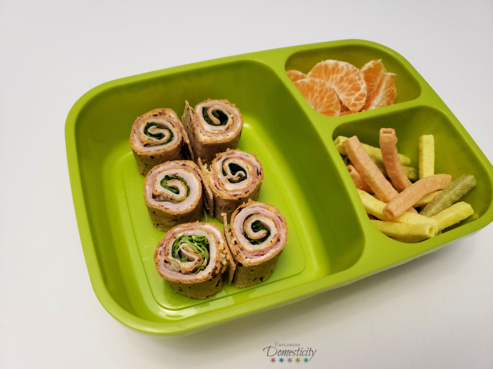 Ham and Turkey Club Pinwheel Sandwich Bento Box with veggie straws and oranges
