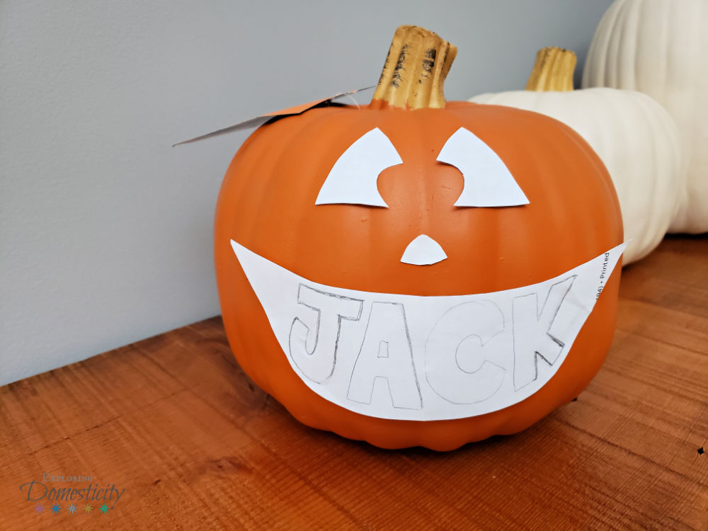 Carving a Personalized Name Pumpkin for Halloween - the template with the name in the mouth