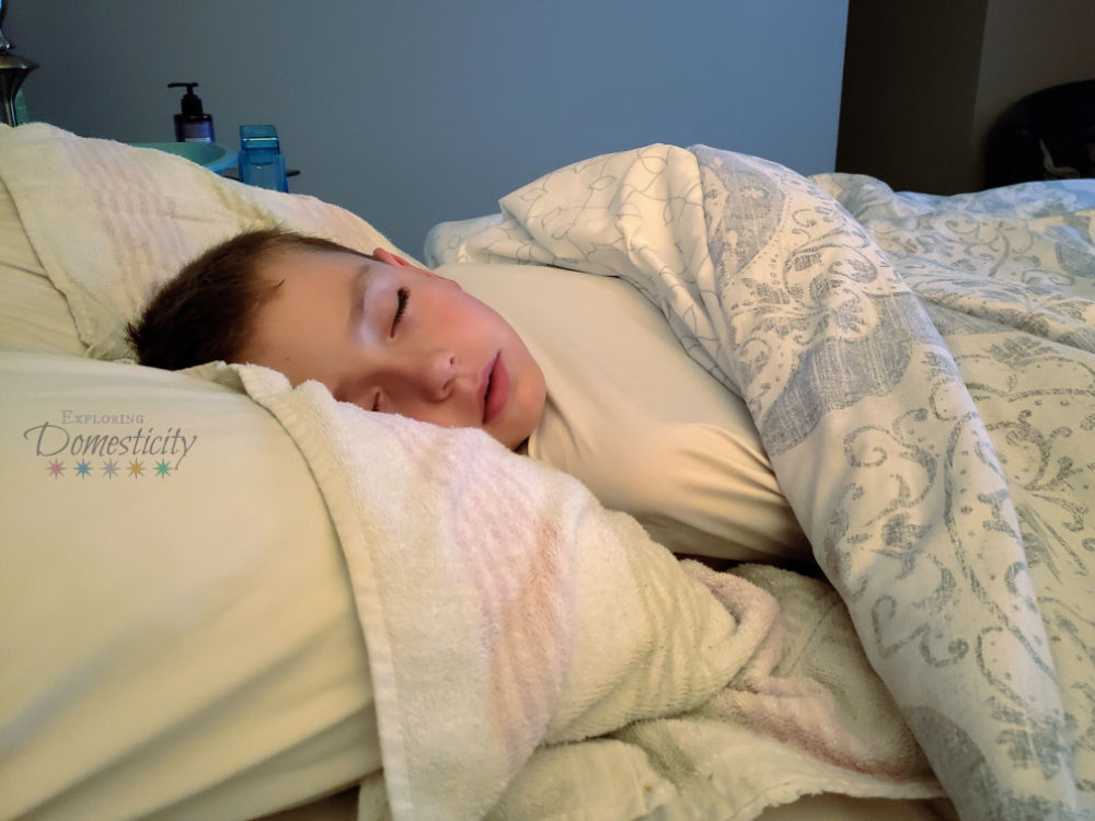 sick kiddo asleep in mom and dad's bed