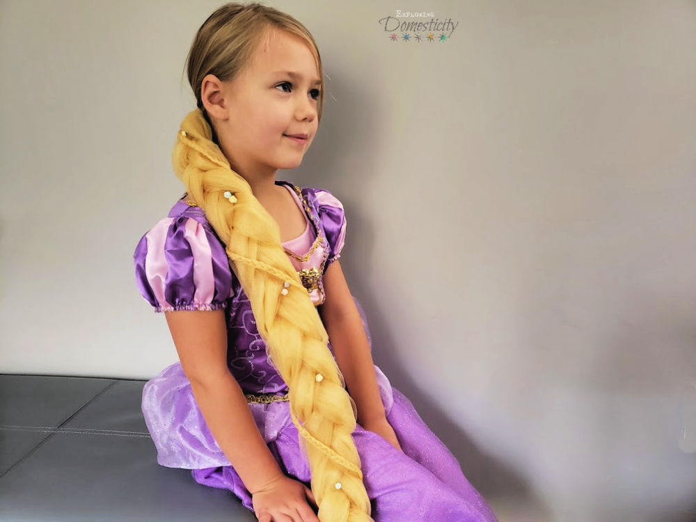 girl in Rapunzel costume with DIY hair braid