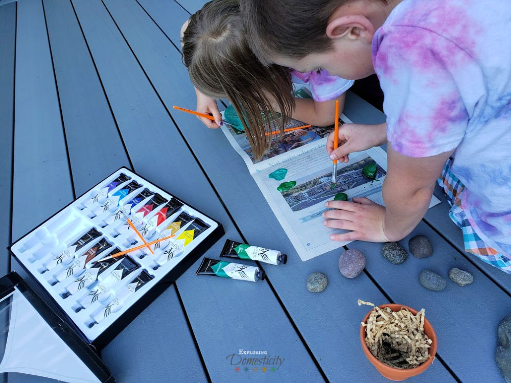 Kids painting rocks for cactus gift