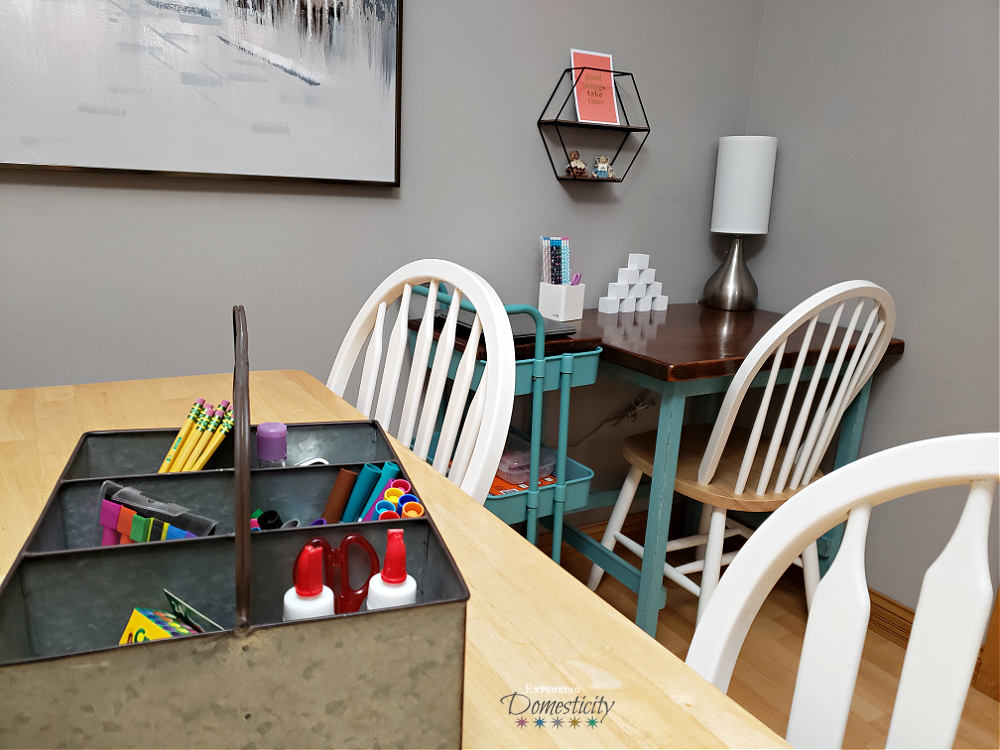 distance learning space with supplies caddy for dining table