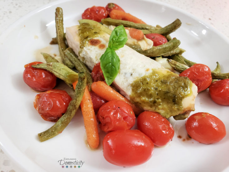 Pesto Chicken with mozzarella, carrots, green beans, and tomatoes sheet pan meal